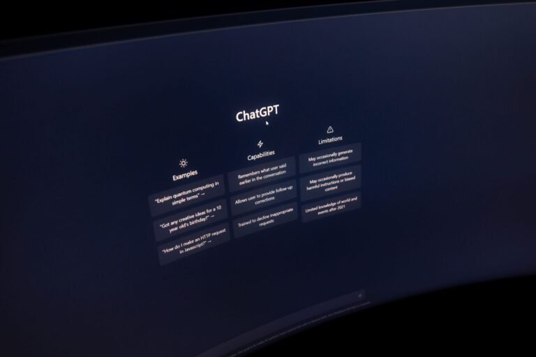 Close-up of a computer screen displaying the ChatGPT interface in a dark setting.