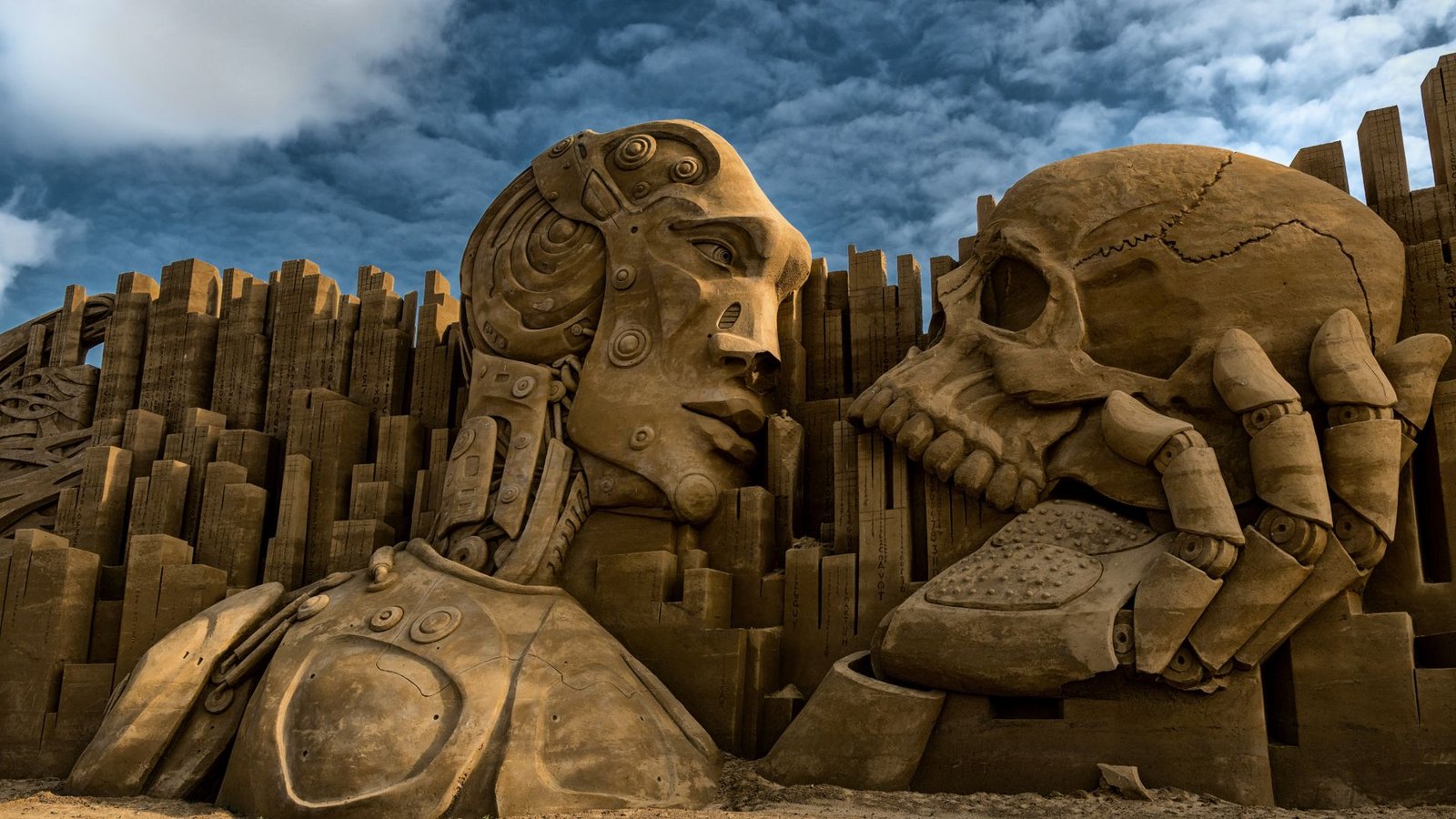 Sand sculpture of a robot with a human skull in Denmark.