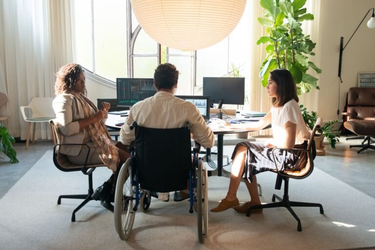Diverse team having a discussion in a modern office.