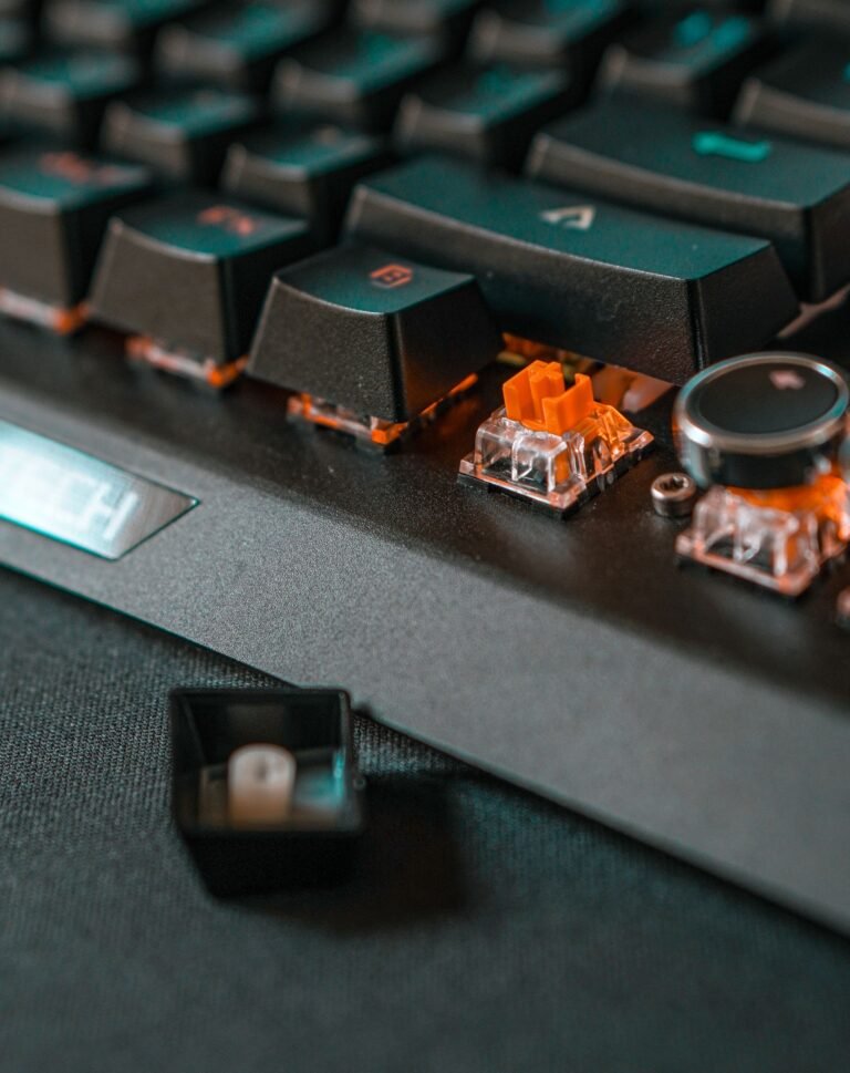 Close-up of a black mechanical keyboard showing individual keycaps and switches.