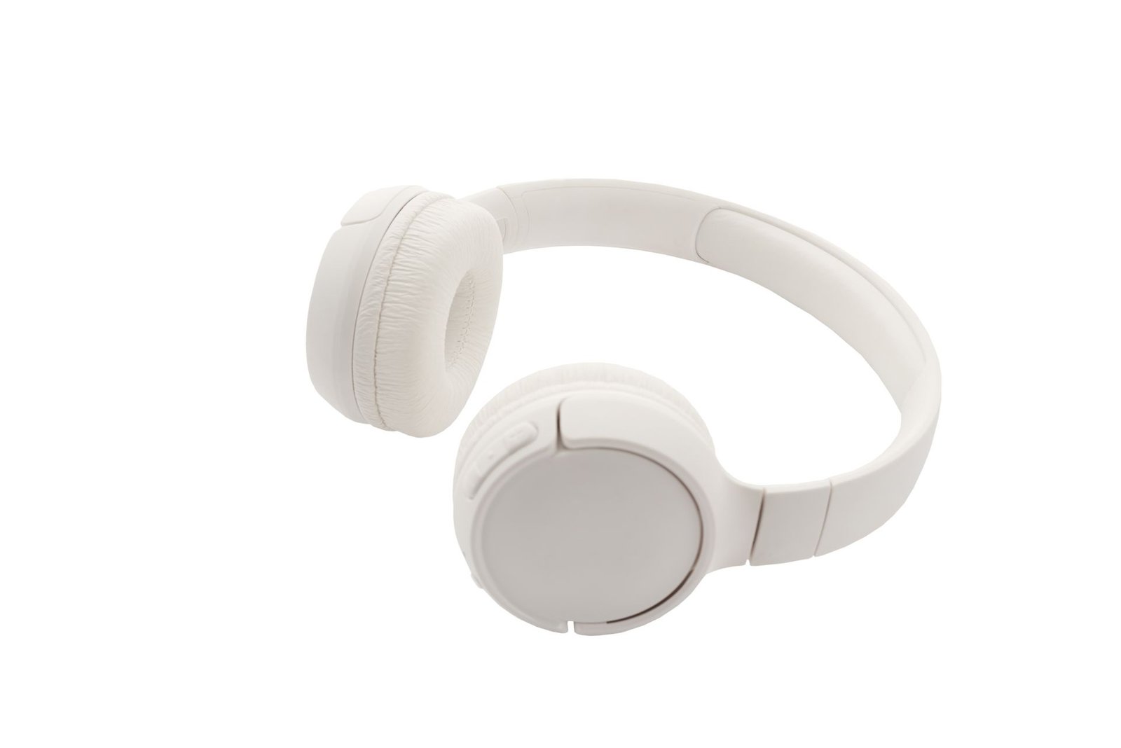 Wireless earbuds in their open charging case next to a smartphone.