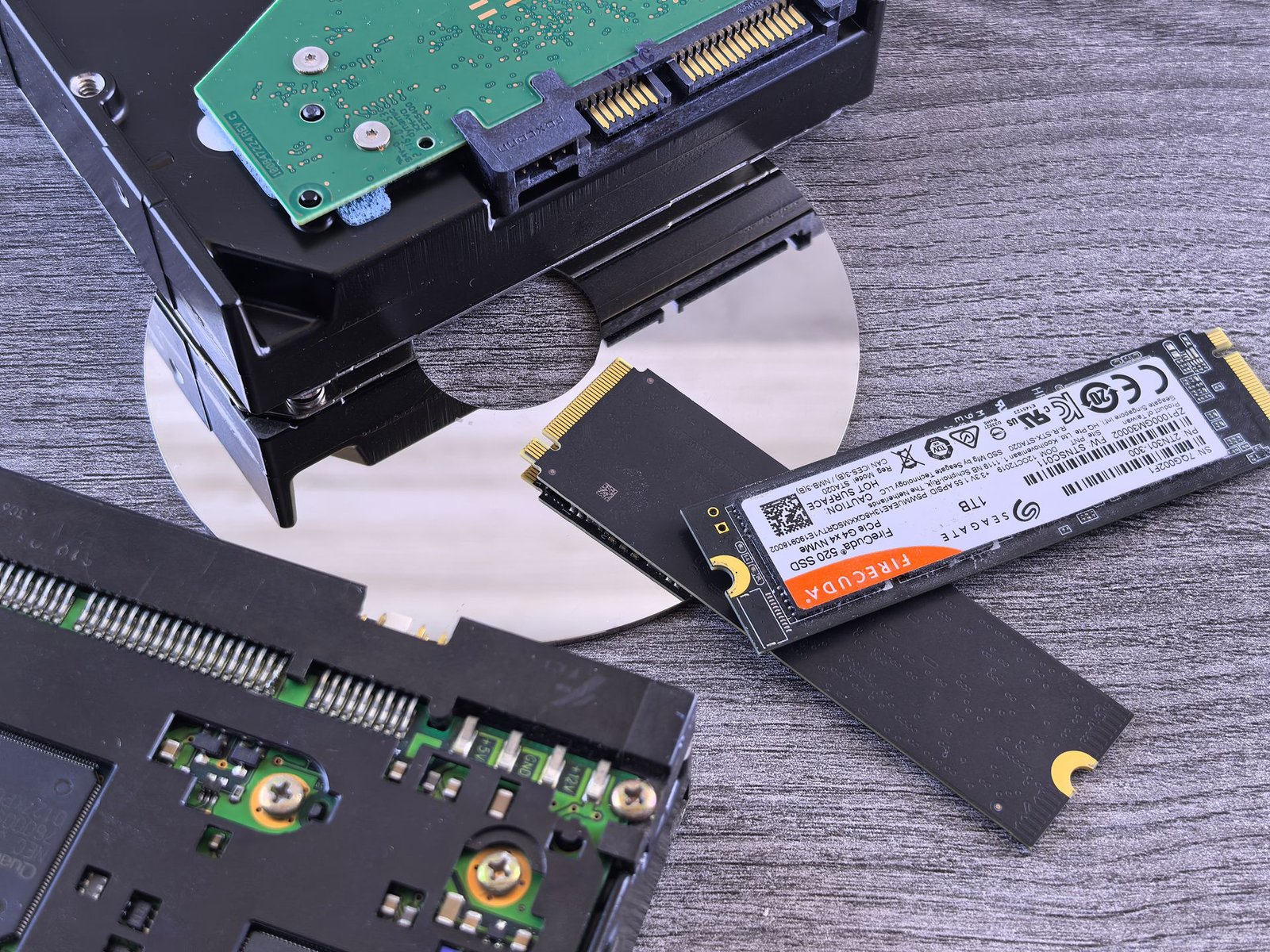 Close-up of an opened hard disk drive showing the platters inside.