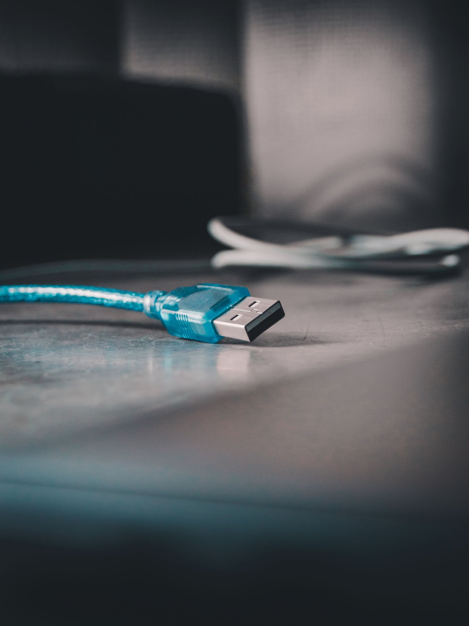 A USB-C hub connected to a laptop with monitor and accessories.
