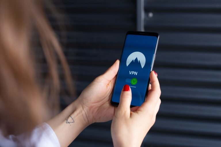 Close-up of hands using a VPN app on a smartphone.