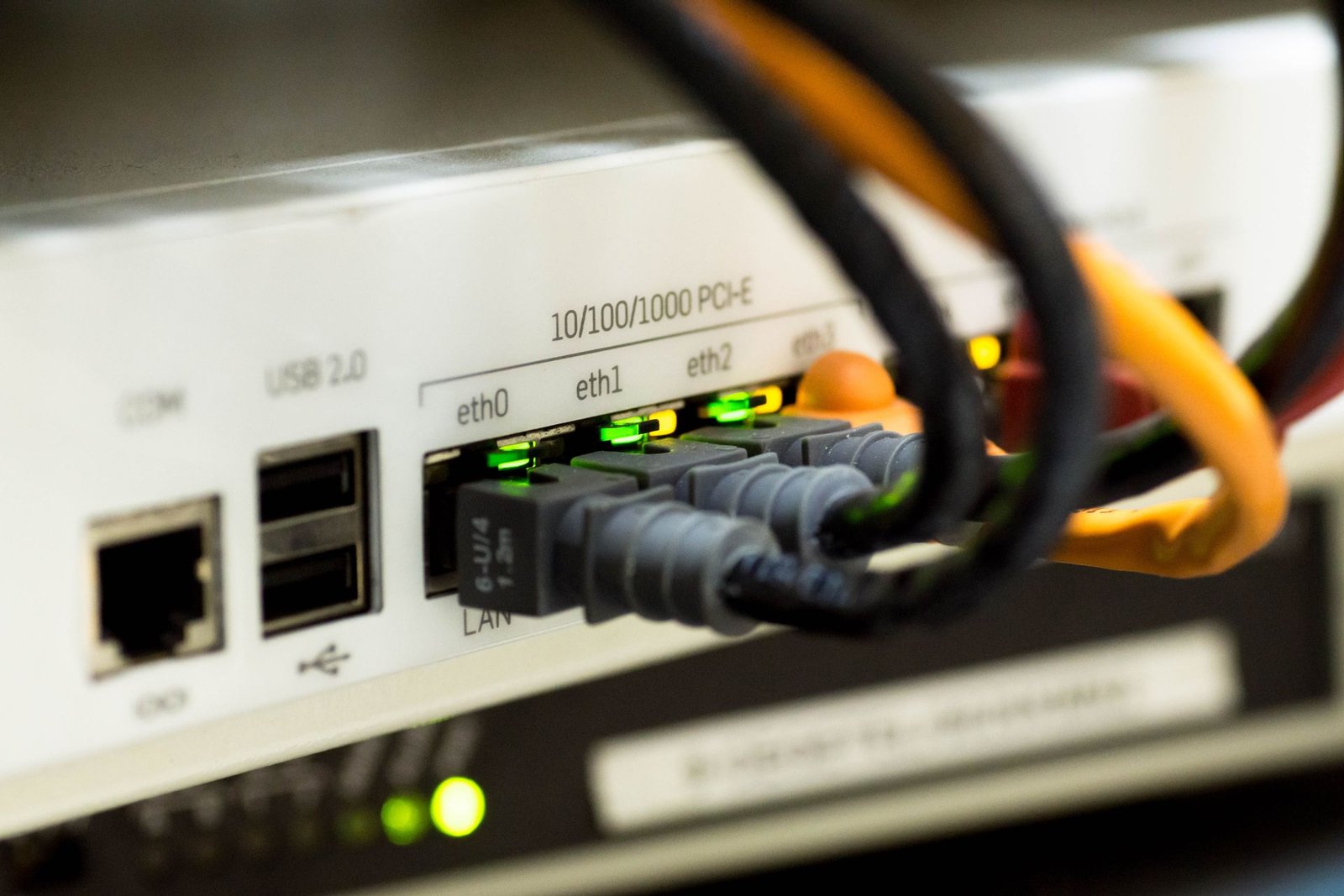 Close-up of ethernet cables plugged into a network switch.