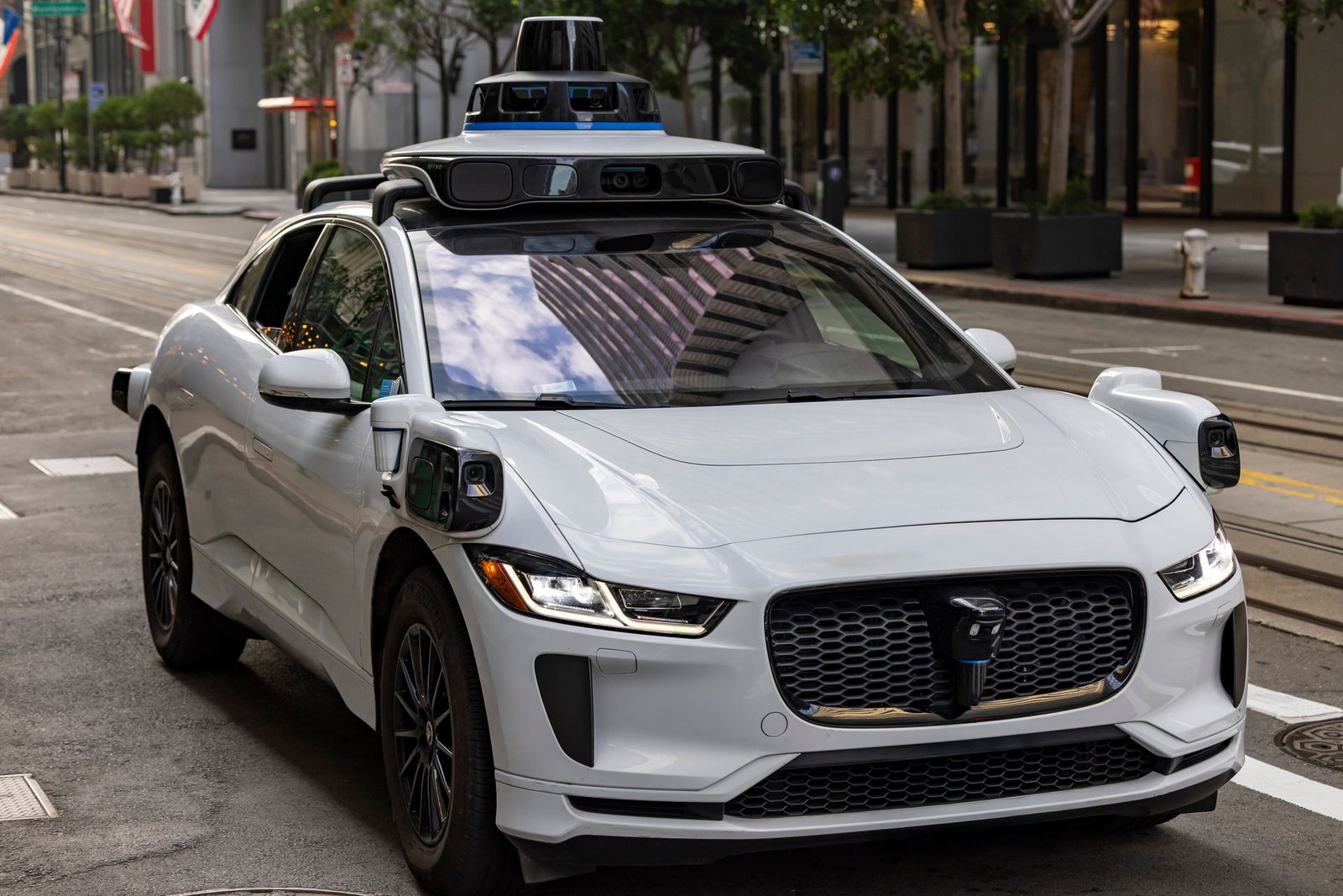 An autonomous self-driving car on an urban street, using computer vision to navigate traffic.
