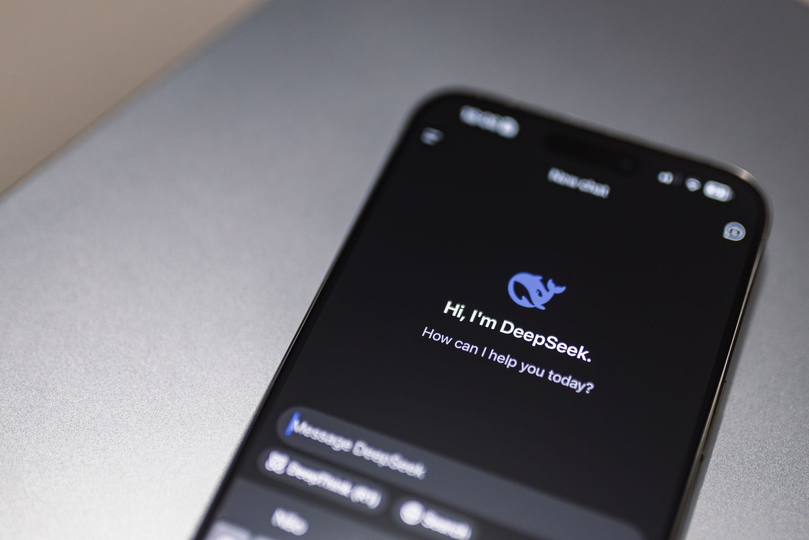 A smartphone displaying an AI chatbot conversation interface in someone's hands.