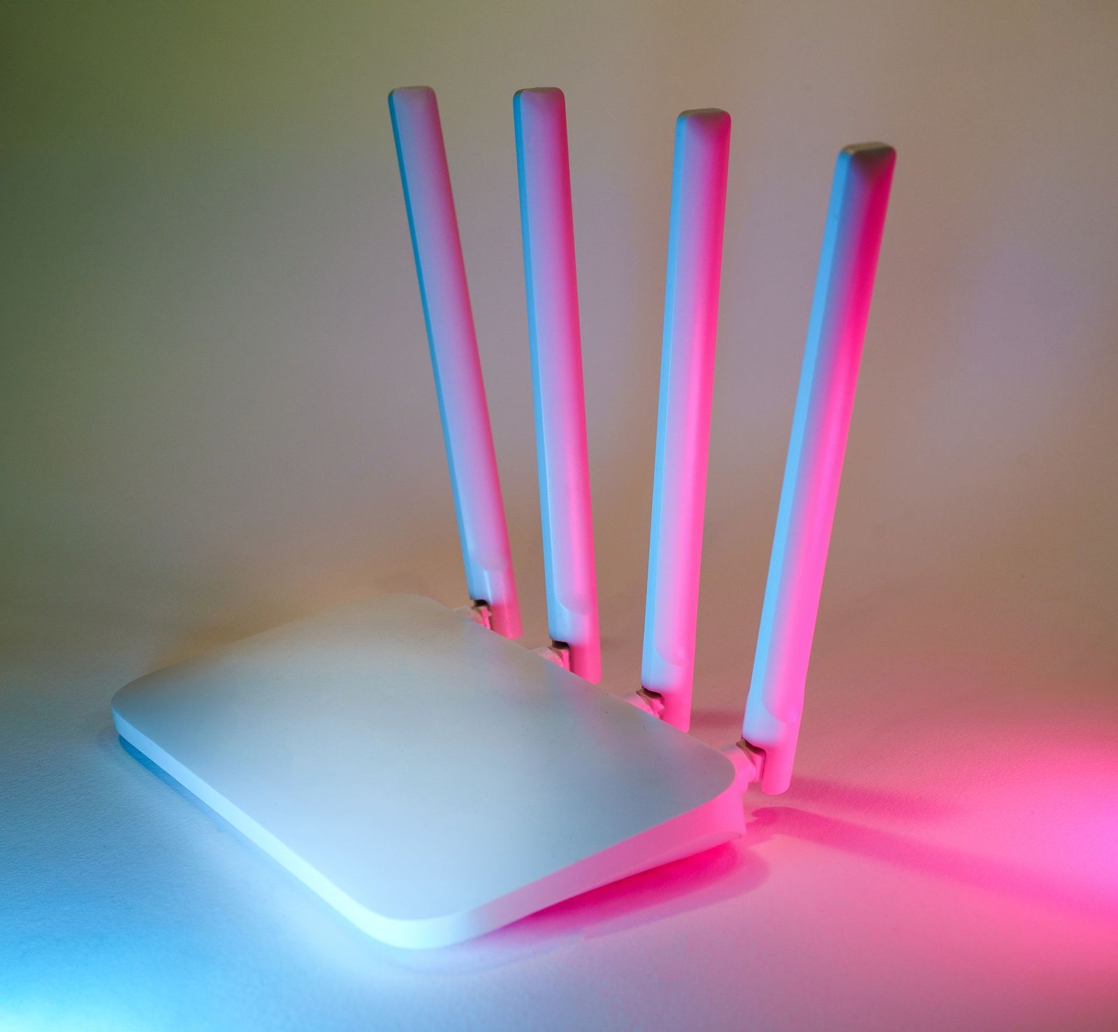 A wireless router enhanced by vibrant neon lights, showcasing modern network technology.