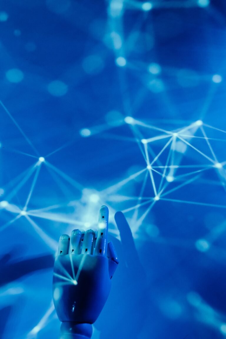 A futuristic robotic hand touching a glowing digital network on a blue background.